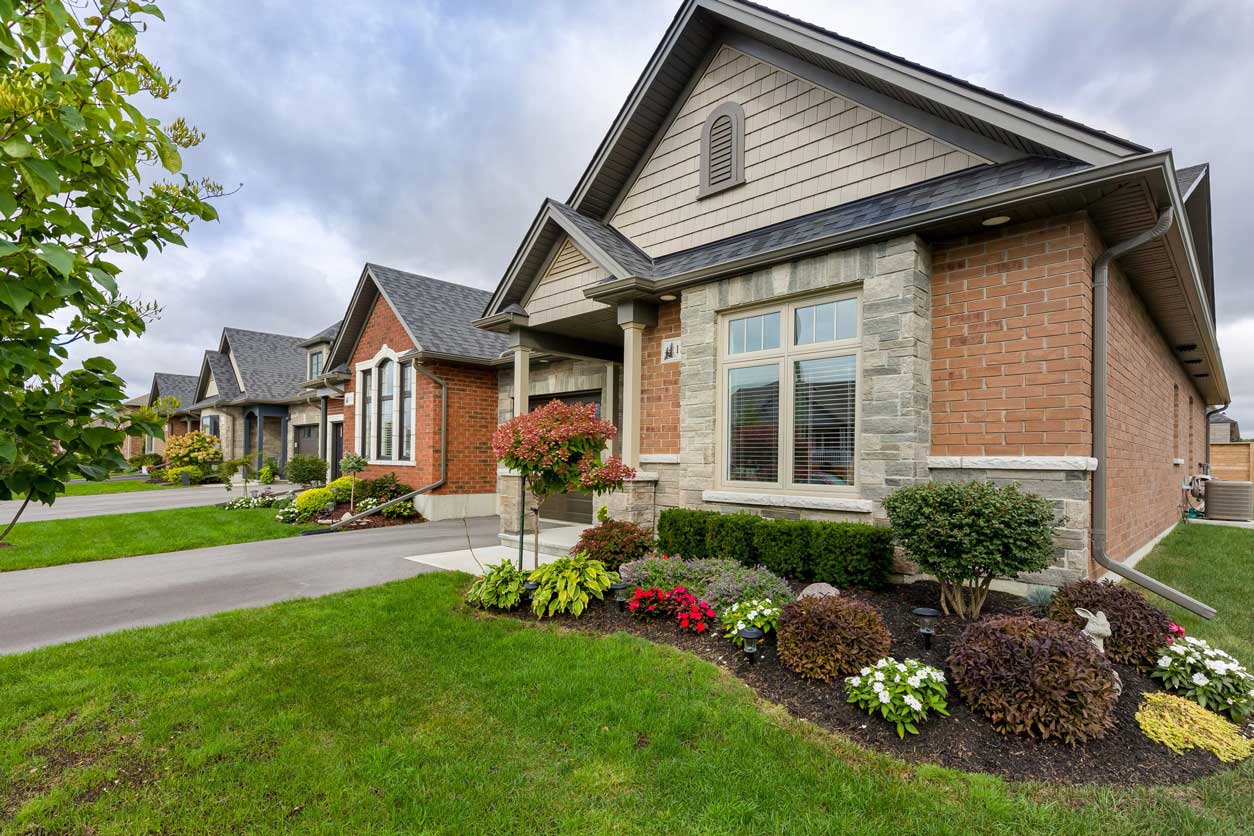 Townhome with mixed masonry and landscaped garden